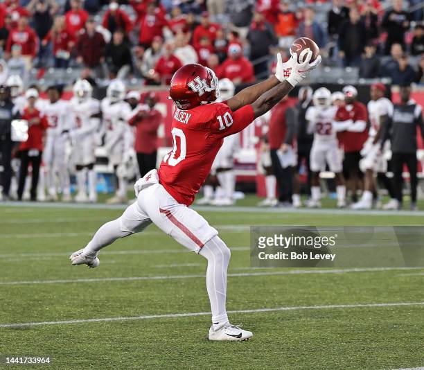 Matthew Golden of the Houston Cougars catches a pass for a touchdown against the Temple Owls at TDECU Stadium on November 12, 2022 in Houston, Texas.
