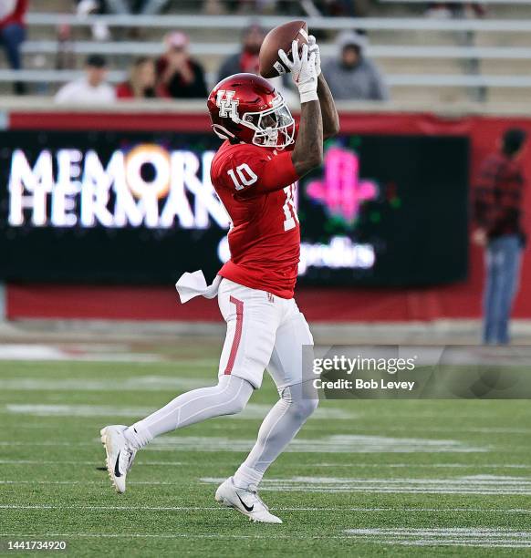 Matthew Golden of the Houston Cougars catches a pass against the Temple Owls during the second half at TDECU Stadium on November 12, 2022 in Houston,...