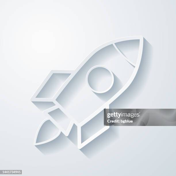 rocket. icon with paper cut effect on blank background - rocket fire isolated stock illustrations