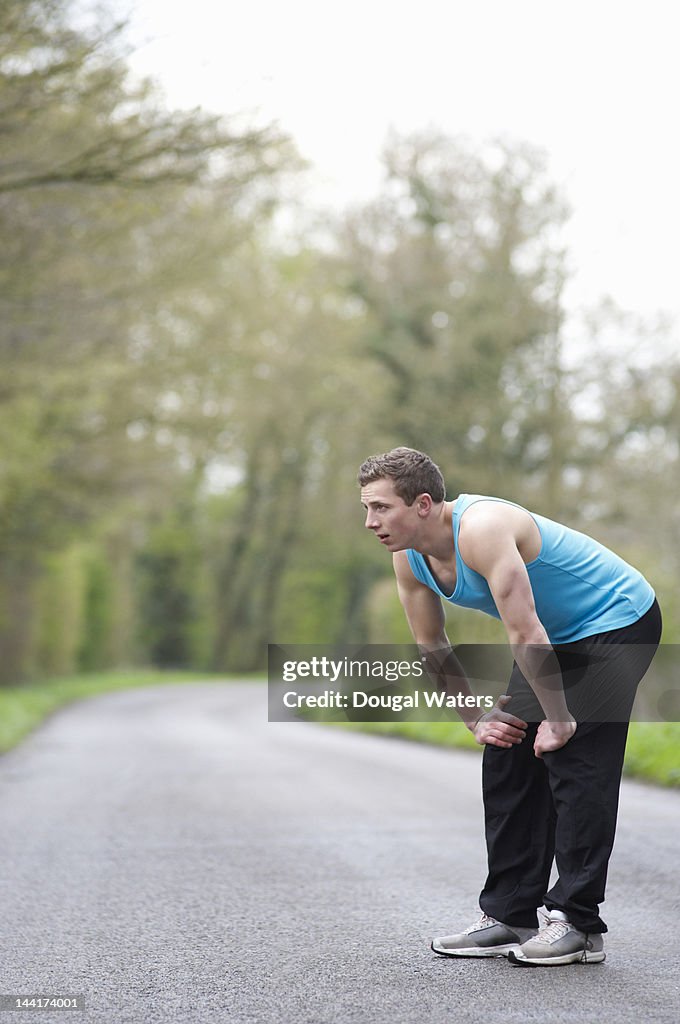 Male athlete in countryside.