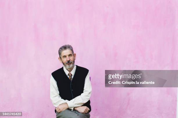 vintage style mature man portrait, pink background - male man portrait one person business confident background stock pictures, royalty-free photos & images