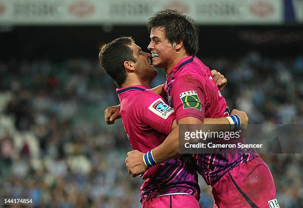 Francois Venter and Morne Steyn of the Bulls celebrate winning the round 12 Super Rugby match between the Waratahs and the Bulls at Allianz Stadium...