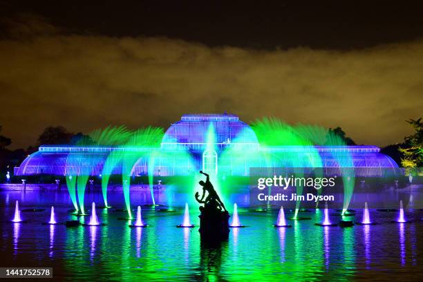 The Palm House at Kew Gardens is illuminated with a light show during a preview for the Christmas at Kew event on November 15, 2022 in London,...