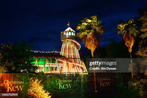 Visitors follow an illuminated trail during a preview for the Christmas at Kew event at Kew Gardens on November 15, 2022 in London, England.