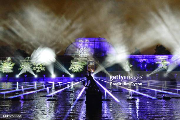 The Palm House at Kew Gardens is illuminated with a light show during a preview for the Christmas at Kew event on November 15, 2022 in London,...