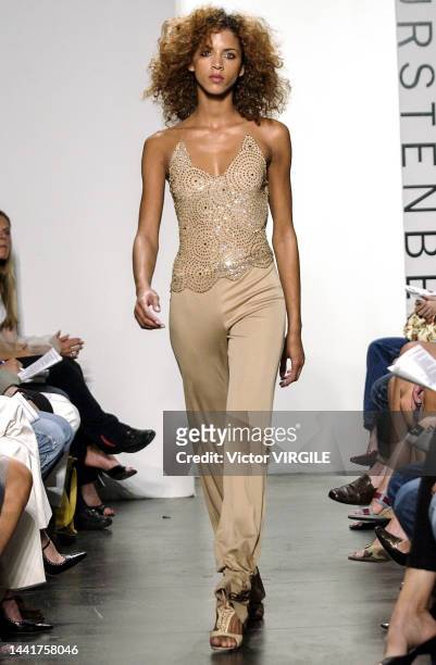 Noémie Lenoir walks the runway during the Diane Von Furstenberg Ready to Wear Spring/Summer 2002 fashion show as part of the New Nork Fashion Week on...