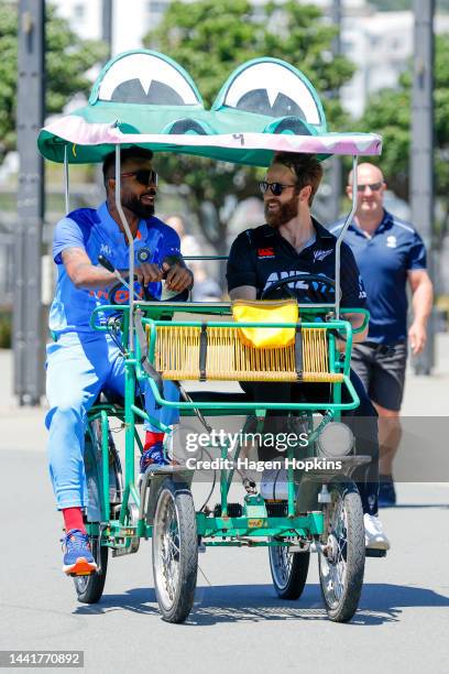 Kane Williamson of New Zealand and Hardik Panya of India arrive on a 'Crocodile Bike' for a media opportunity ahead of the New Zealand and India T20...