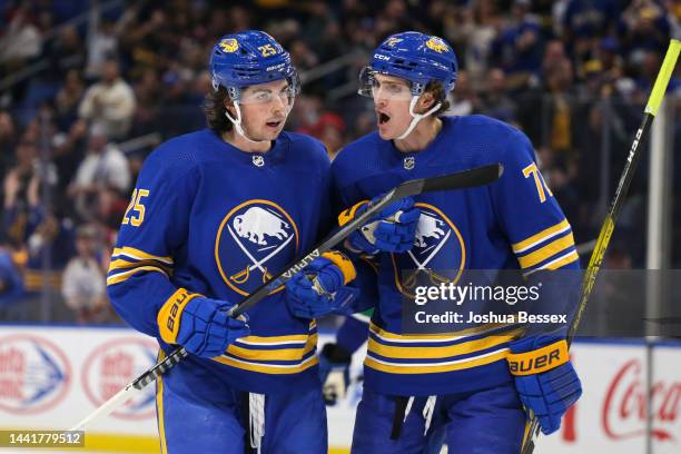 Owen Power and Tage Thompson of the Buffalo Sabres celebrate their assists after a goal by Alex Tuch during the second period of an NHL hockey game...