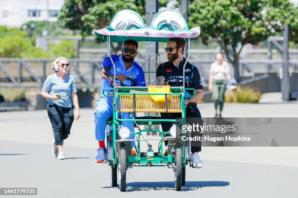 Kane Williamson of New Zealand and Hardik Panya of India arrive on a 'Crocodile Bike' for a media opportunity ahead of the New Zealand and India T20...