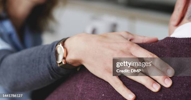 hand, empathy and support consulting man in nursing home in grief with cancer diagnosis closeup. consultation, doctor and senior patient at retirement home sad and depressed with health update. - man touching shoulder stock pictures, royalty-free photos & images