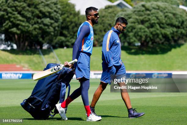 Hardik Pandya and Strength and Conditioning Coach Harsha A I look on during an India training session ahead of the New Zealand and India T20...