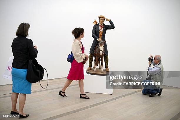 People visit on May 11, 2012 an exhibition preview of US artist Jeff Koons' work at the Fondation Beyeler museum in Basel. The Fondation Beyeler is...