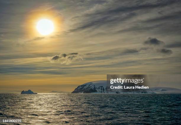 sunset in the antarctica peninsula - antarctica sunset stock pictures, royalty-free photos & images