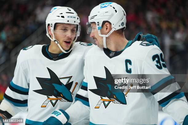 Matt Benning and Logan Couture of the San Jose Sharks talk during the first period of a game against the Vegas Golden Knights at T-Mobile Arena on...