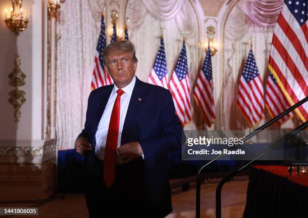 Former U.S. President Donald Trump leaves the stage after speaking during an event at his Mar-a-Lago home on November 15, 2022 in Palm Beach,...