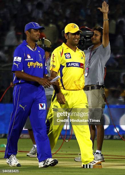 Rajasthan Royals captain Rahul Dravid and Chennai Super Kings captain M S Dhoni walks together after the toss at the ground as rain delayed play at...