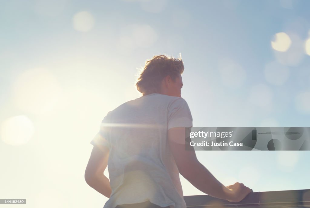 Portrait of a man standing in sunshine