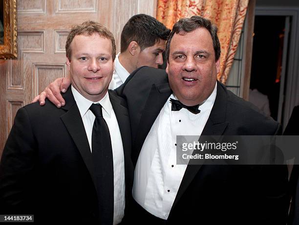 Chris Licht, vice president of programming and executive producer at CBS News Inc., left, and Chris Christie, governor of New Jersey, attend the...