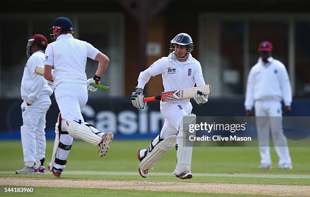 James Taylor of England Lions runs with fellow half centurian Jonny Bairstow of England Lions during day two of the tour match between England Lions...