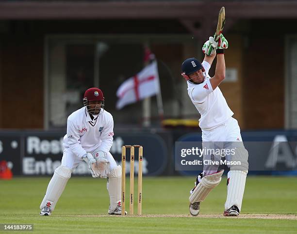 Jonny Bairstow of England Lions in action on his way to a half century watched by Denesh Ramdin of West Indies during day two of the tour match...