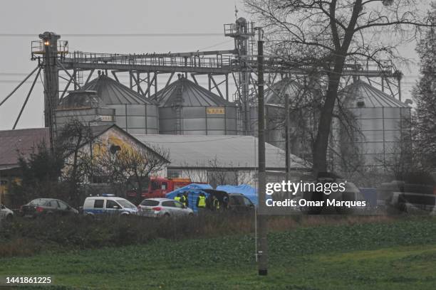 View of police officers next to the blast site of a missile on November 16, 2022 in Przewodow, Poland. Poland convenes a meeting of its national...