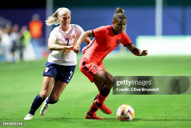 Nikita Parris of England battles for possession with Anja Sonstevold of Norway during the International Friendly between England and Norway at...