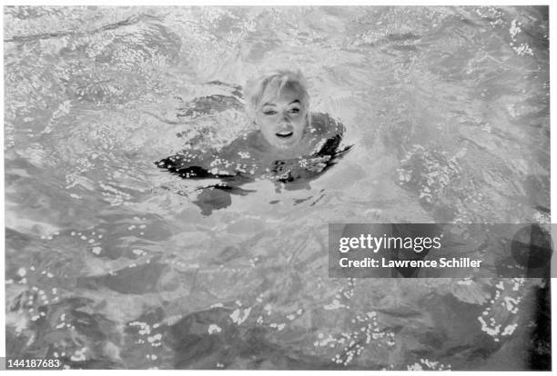 American actress Marilyn Monroe swims in a pool for a scene during the filming of 'Something's Got to Give' , Los Angeles, California, May 23, 1962.
