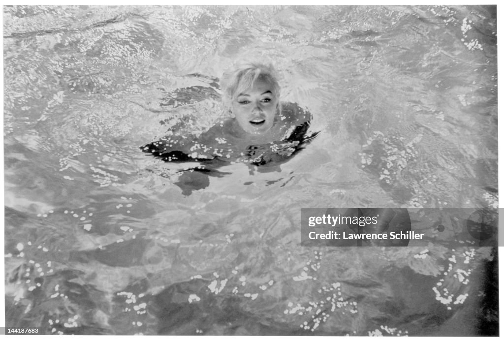 American Actress Marilyn Monroe Swims In A Pool For A Scene During american-actress-marilyn-monroe-swims-in-a-pool-for-a-scene-during