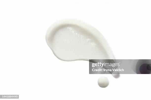 smear of beauty product white gel or cosmetic moisturizing cream on white color background. - crèmekleurig stockfoto's en -beelden