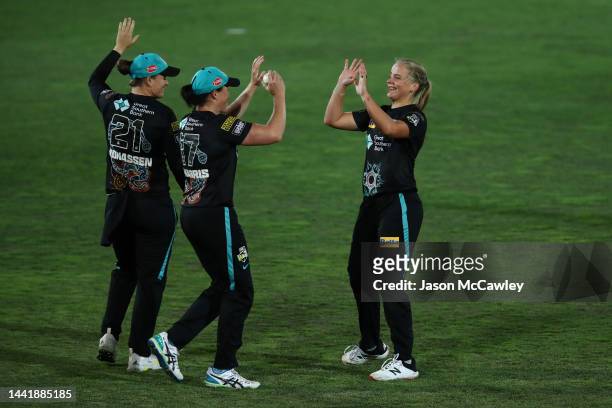 Jess Kerr of the Heat celebrates after taking the wicket of Ashleigh Gardner of the Sixers during the Women's Big Bash League match between the...