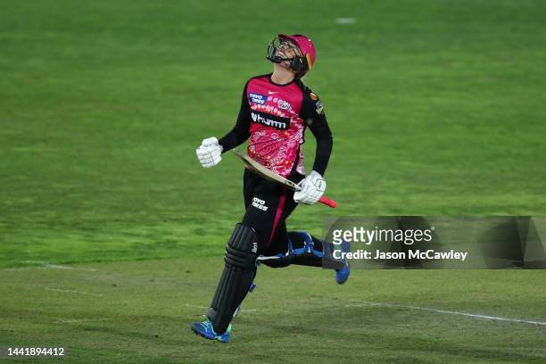 Sophie Ecclestone of the Sixers celebrates hitting the winning runs during the Women's Big Bash League match between the Sydney Sixers and the...