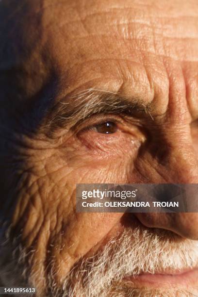 close up of old man face portrait with wrinkles and grey beard - man crying tears stock pictures, royalty-free photos & images