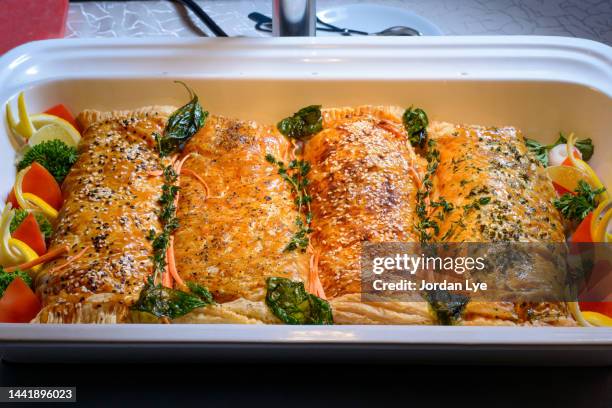 salmon en croute in a tray - aliment en portion stock pictures, royalty-free photos & images