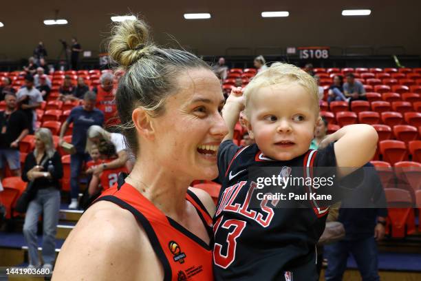 Sami Whitcomb of the Lynx shares a moment with her son Nash after winning the round three WNBL match between Perth Lynx and Sydney Flames at Bendat...