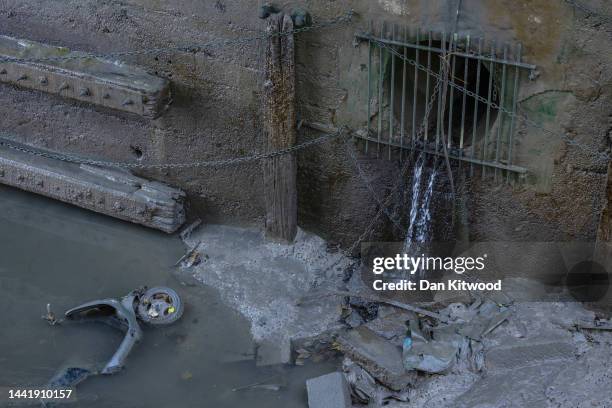 Sewage overflow outlet discharges into the River Thames on November 16, 2022 in Putney, England. England's water-treatment companies are under...