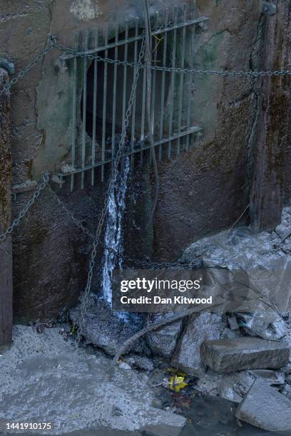 Sewage overflow outlet discharges into the River Thames on November 16, 2022 in Putney, England. England's water-treatment companies are under...