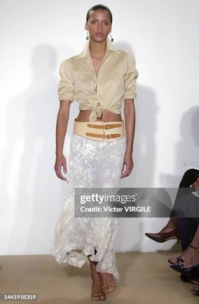 Noémie Lenoir walks the runway during the Ralph Lauren Ready to Wear Spring/Summer 2002 fashion show as part of the New York Fashion Week on...