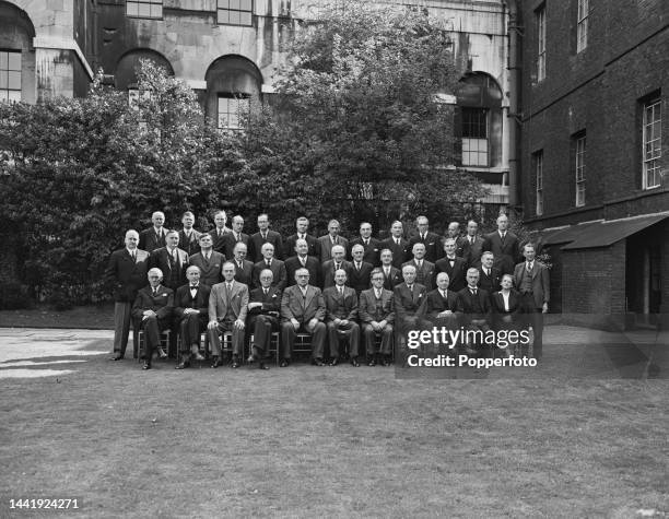 Prime Minister and Labour Party leader, Clement Attlee , with members of his new cabinet in the garden of No 10 Downing Street in London following...