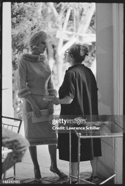 American actress Marilyn Monroe and her dialogue coach Paula Strasberg discuss a scene on set during the filming of 'Something's Got to Give' , Los...