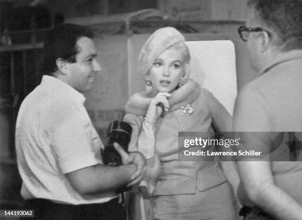 American actress Marilyn Monroe poses with photographers Lawrence Schiller and William Read Woodfield on the set her film 'Something's Got to Give' ,...