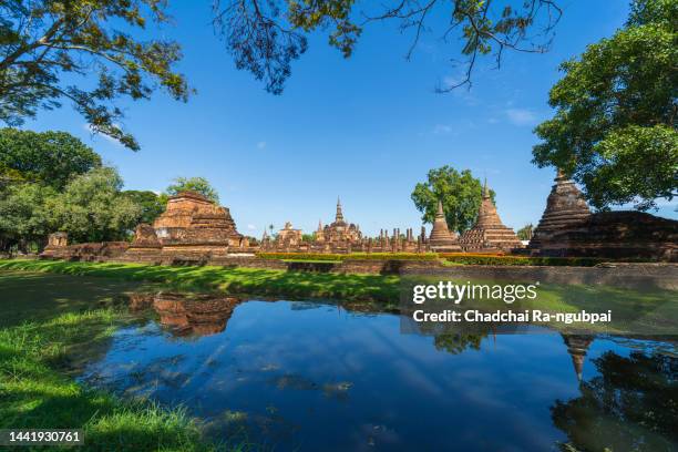 travel buddha statue  temple ruins historical park world heritage sukhothai thailand - sukhothai stockfoto's en -beelden