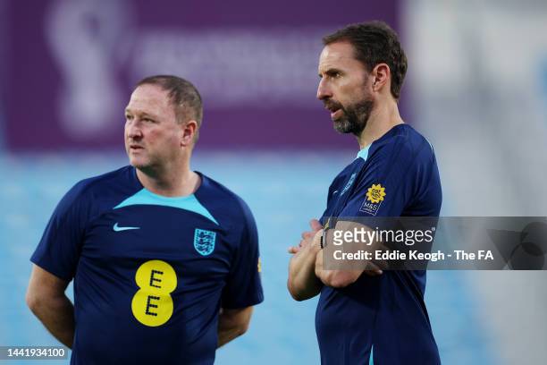 Steve Holland, Assistant Coach of England and Gareth Southgate, Manager of England look on during an England training session at Al Wakrah Stadium on...