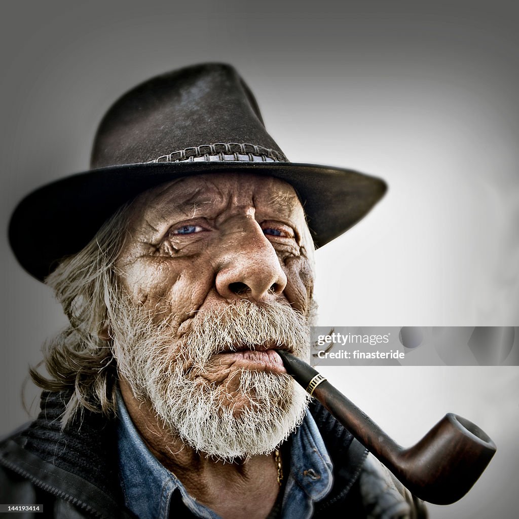 Old man with smoking pipe