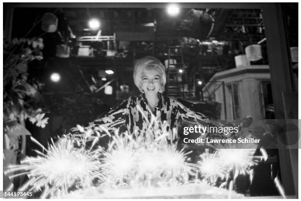 American actress Marilyn Monroe celebrates her birthday with cake and sparklers during the filming of 'Something's Got to Give' , Los Angeles,...