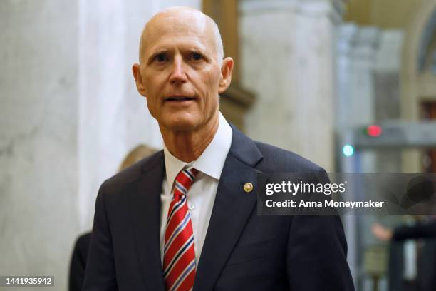 Sen. Rick Scott , who has announced he will challenge Senate Minority Leader Mitch McConnell for the top Senate GOP leadership post, talks with...