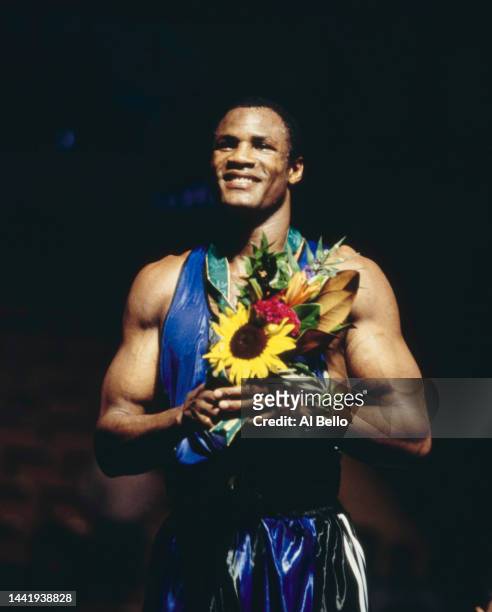 Heavyweight boxer Félix Savón from Cuba stands on the podium after winning the gold medal by defeating David Defiagbon of Canada in the Men's...