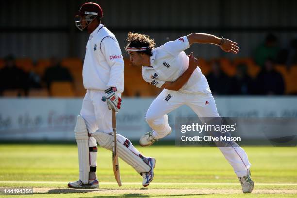 Jack Brooks of England Lions in action bowling as Kieran Powell of West Indies looks on during day two of the tour match between England Lions and...