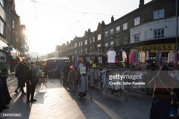 General view of shoppers walking through Barking Town Centre street market on November 14, 2022 in Barking, London.