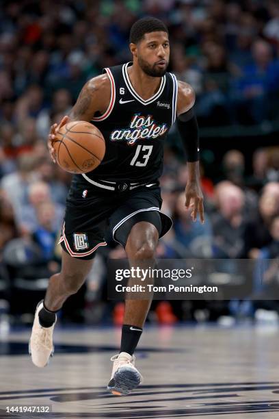 Paul George of the LA Clippers dribbles the ball downcourt against the Dallas Mavericks in the fourth quarter at American Airlines Center on November...