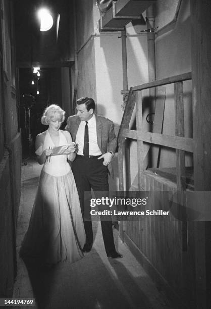 American actress Marilyn Monroe and French actor Yves Montand rehearse lines on set during the filming of their movie 'Let's Make Love' , Los...